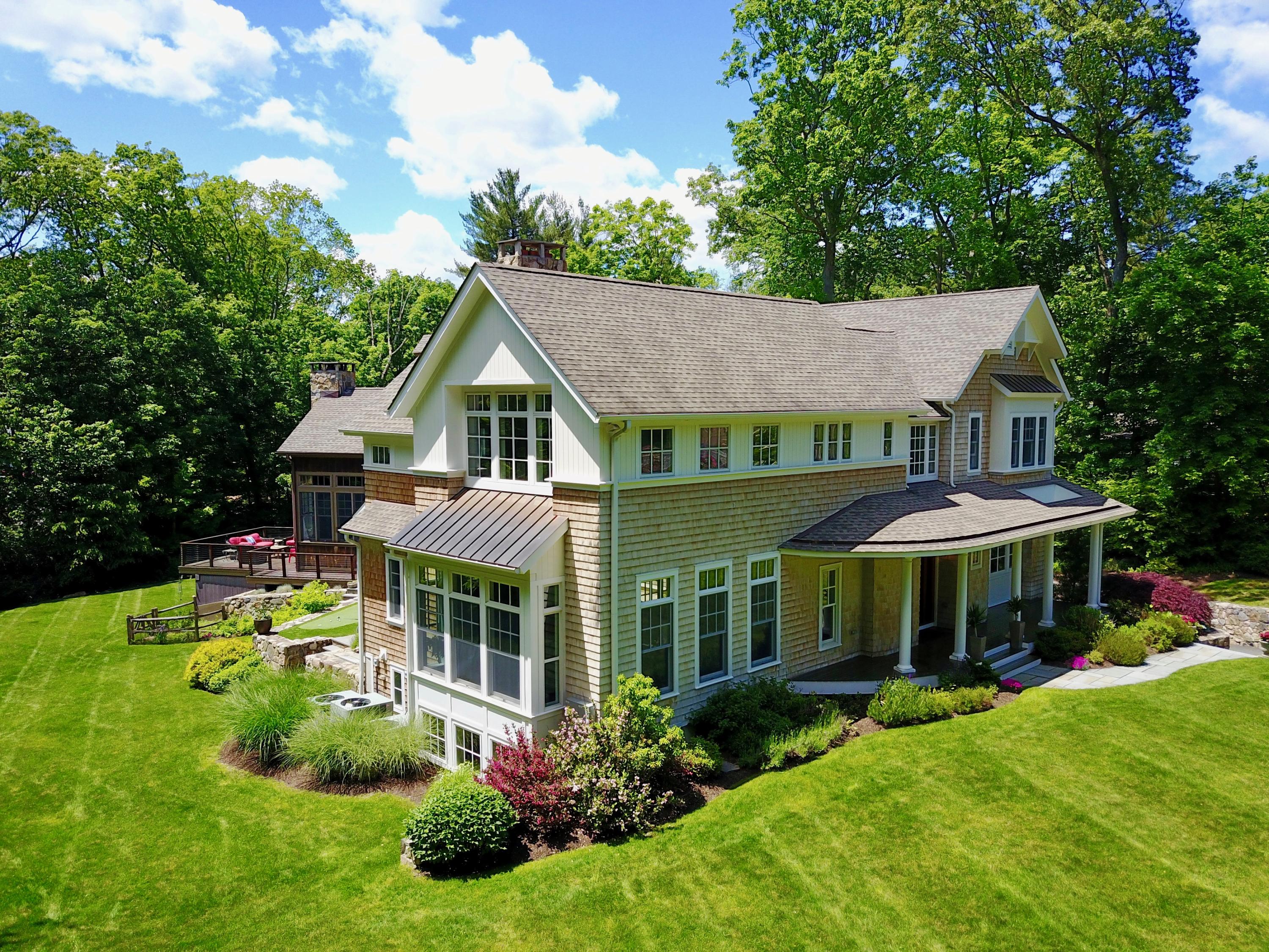a front view of a house with garden