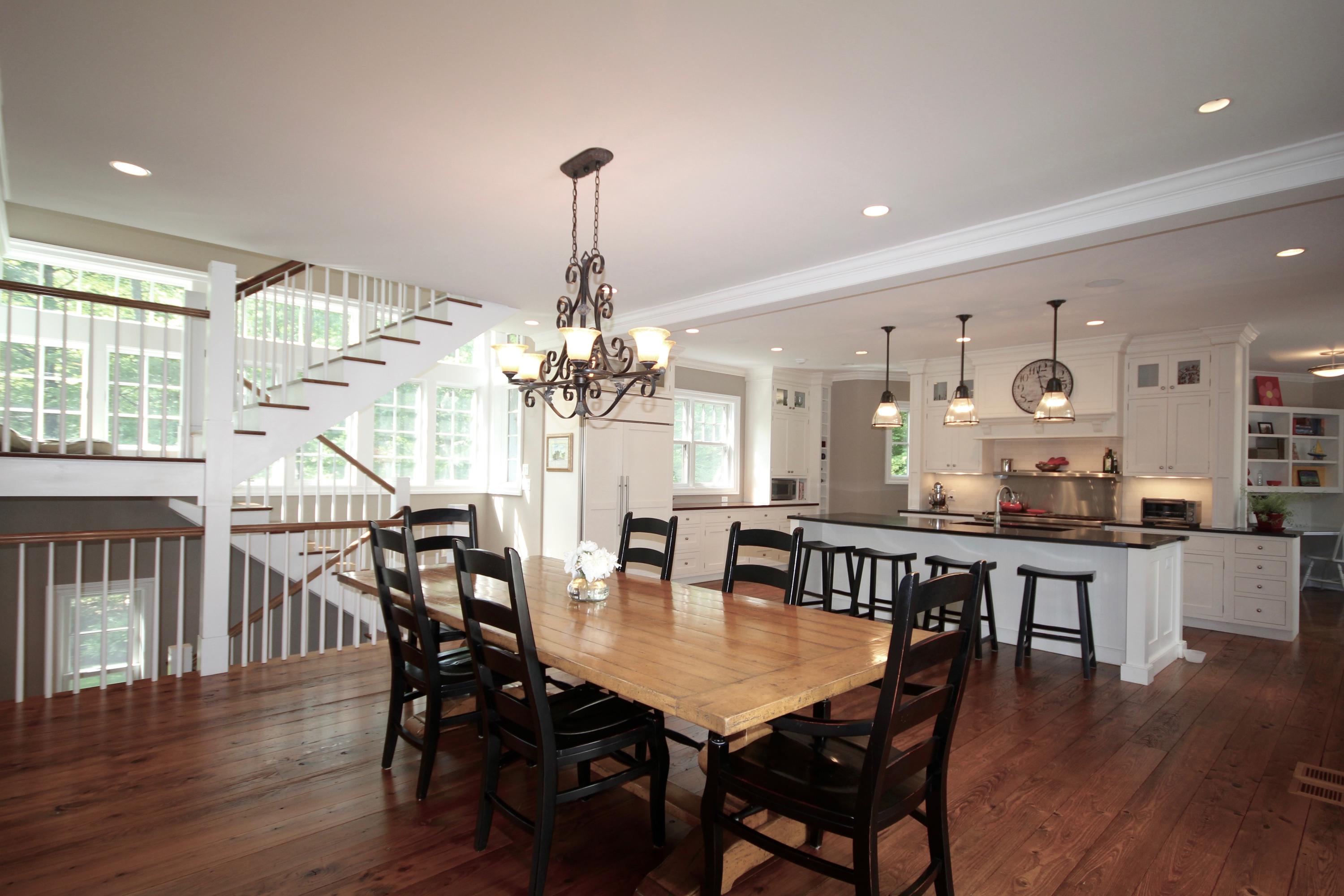 81 Parish Road New Canaan, CT 06840 - Photo 13 of 48 a view of a dining room and livingroom with furniture wooden floor a chandelier