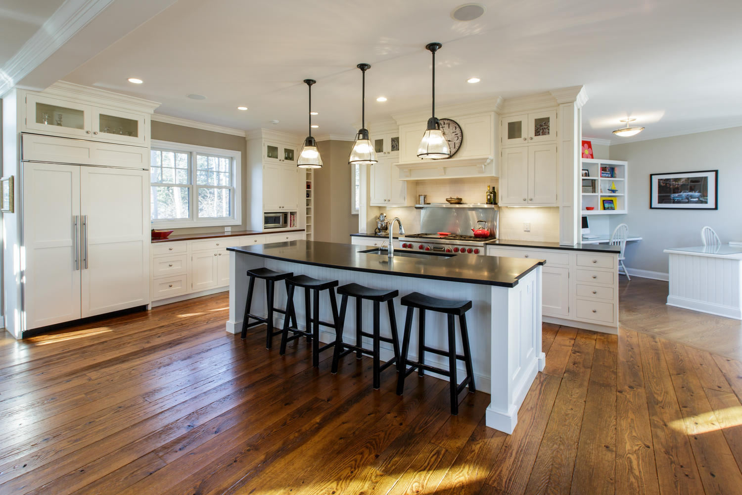 81 Parish Road New Canaan, CT 06840 - Photo 14 of 48 an open kitchen with wooden floor and large window
