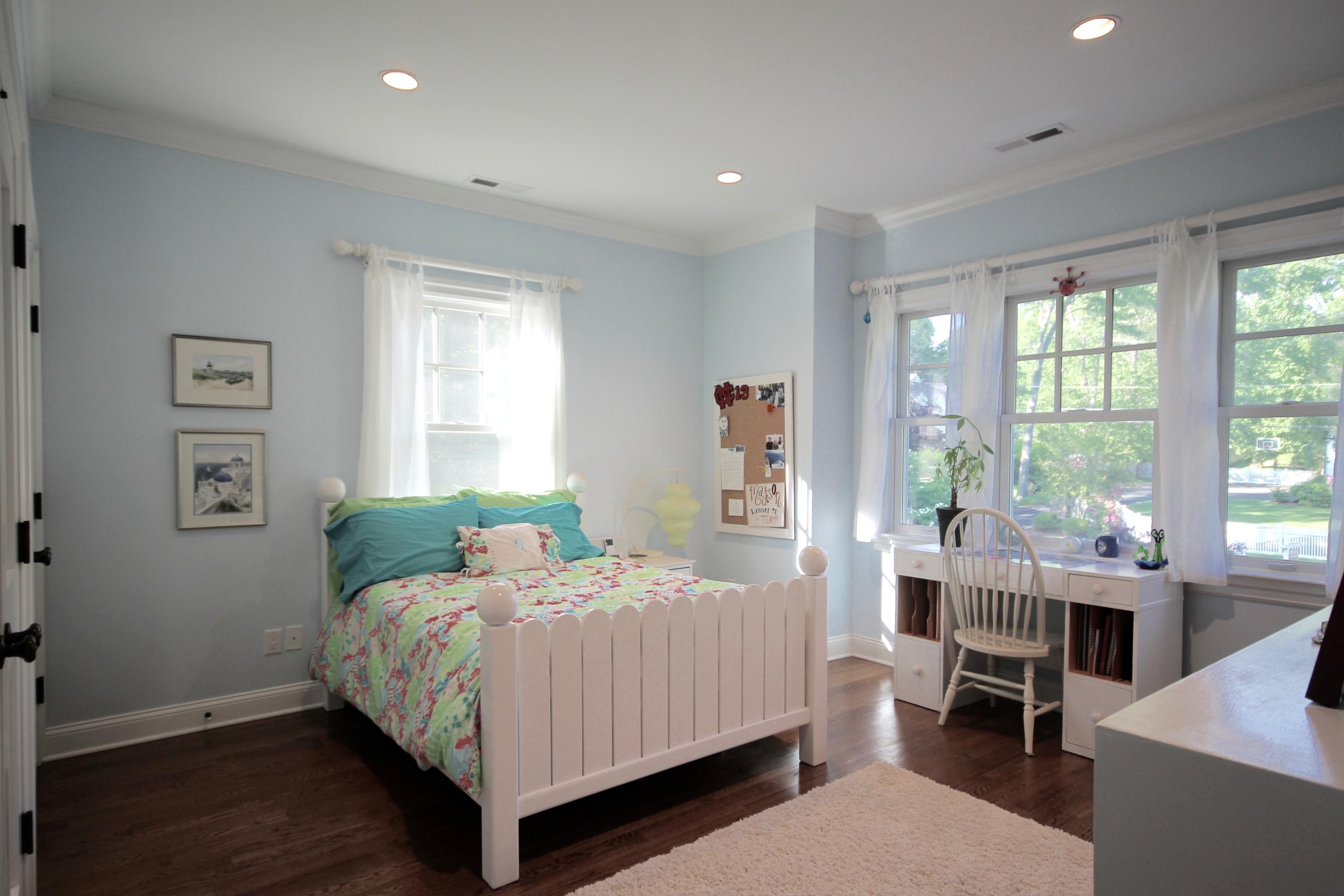 81 Parish Road New Canaan, CT 06840 - Photo 26 of 48 a bedroom with a bed and large windows