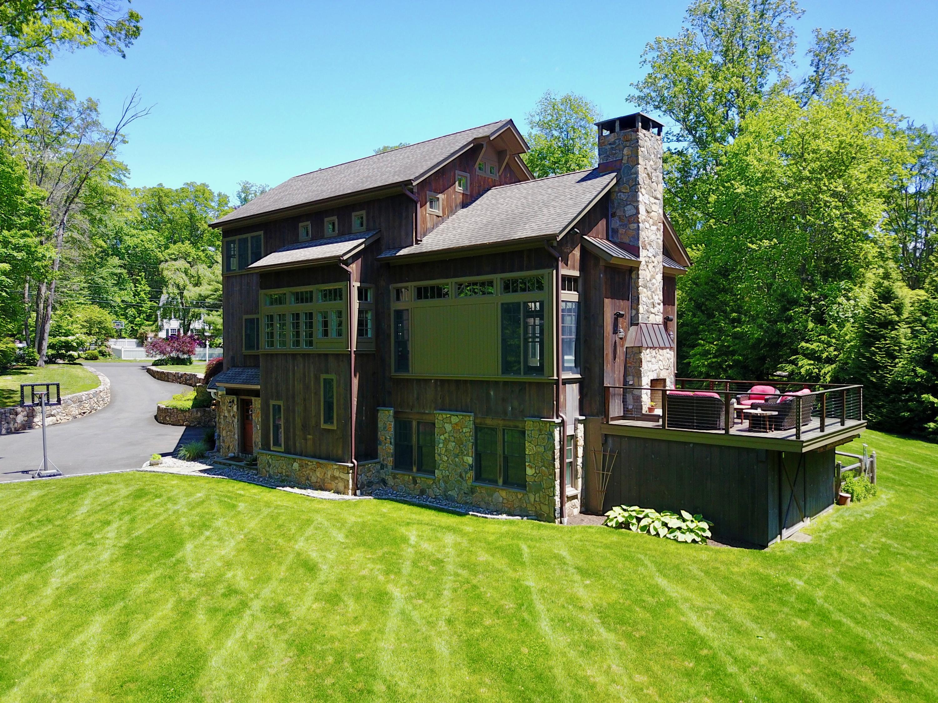 81 Parish Road New Canaan, CT 06840 - Photo 38 of 48 a view of an house with backyard and sitting area