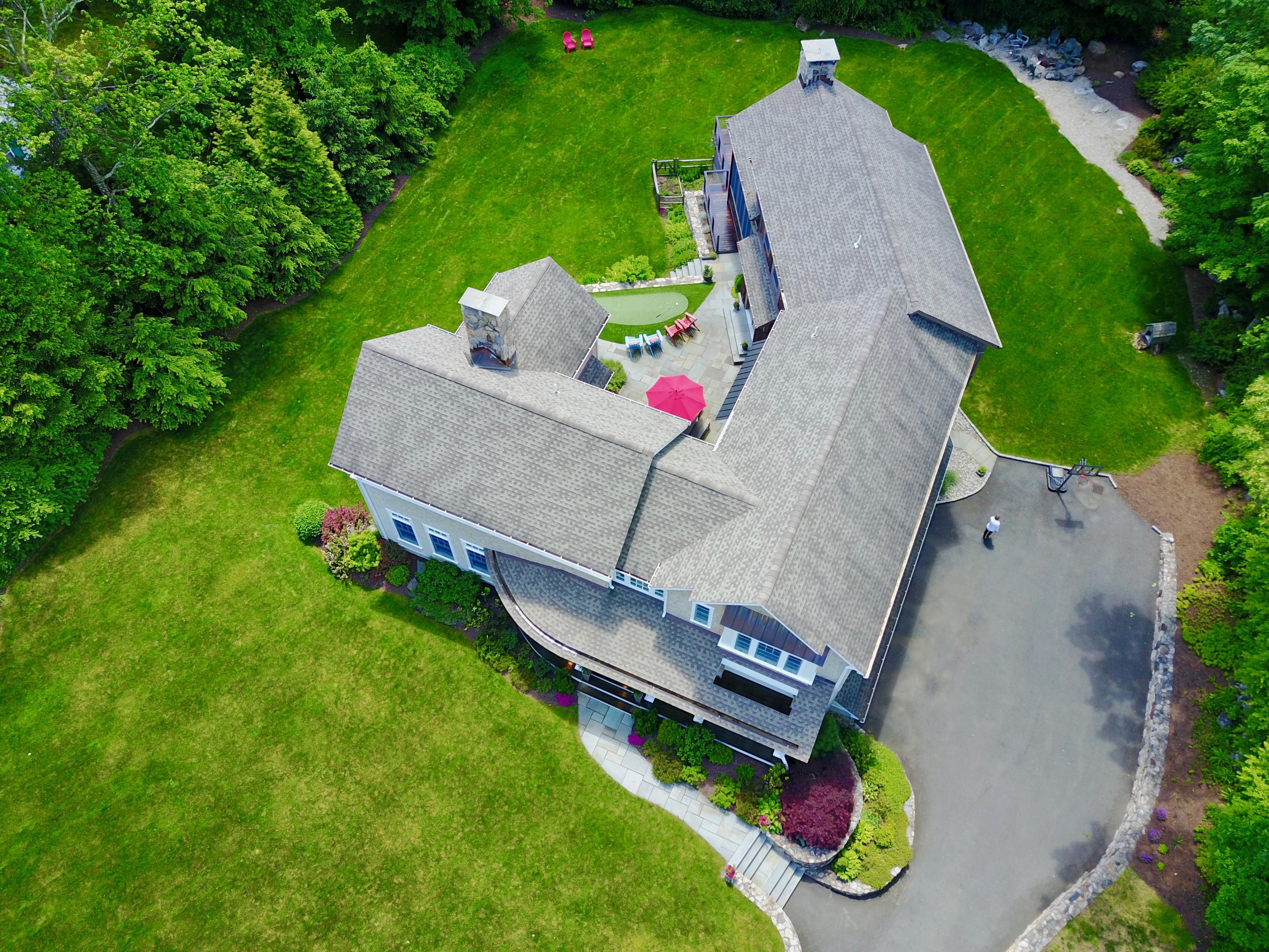 81 Parish Road New Canaan, CT 06840 - Photo 40 of 48 an aerial view of a house with garden space and street view