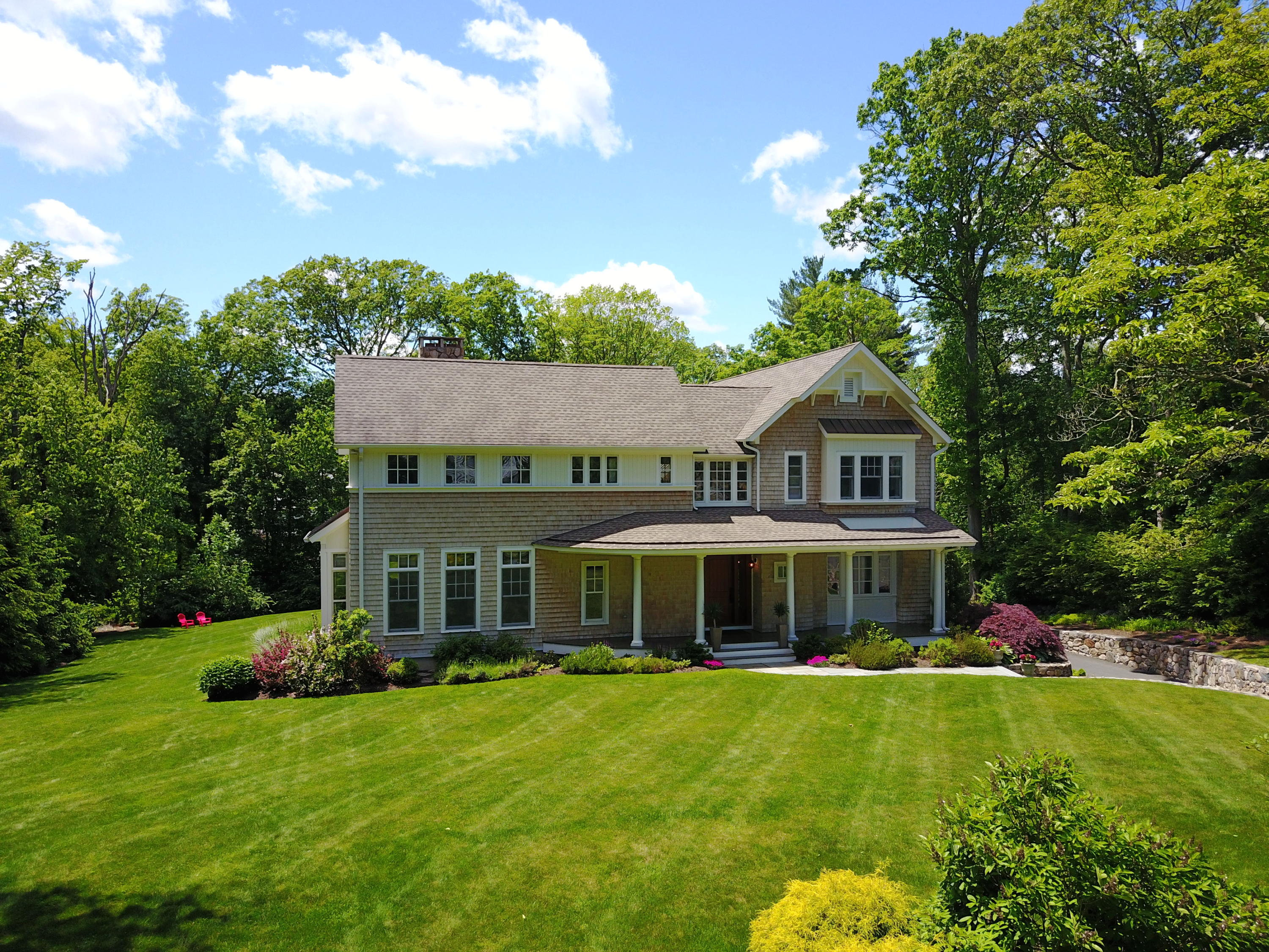 81 Parish Road New Canaan, CT 06840 - Photo 41 of 48 a front view of a house with a yard
