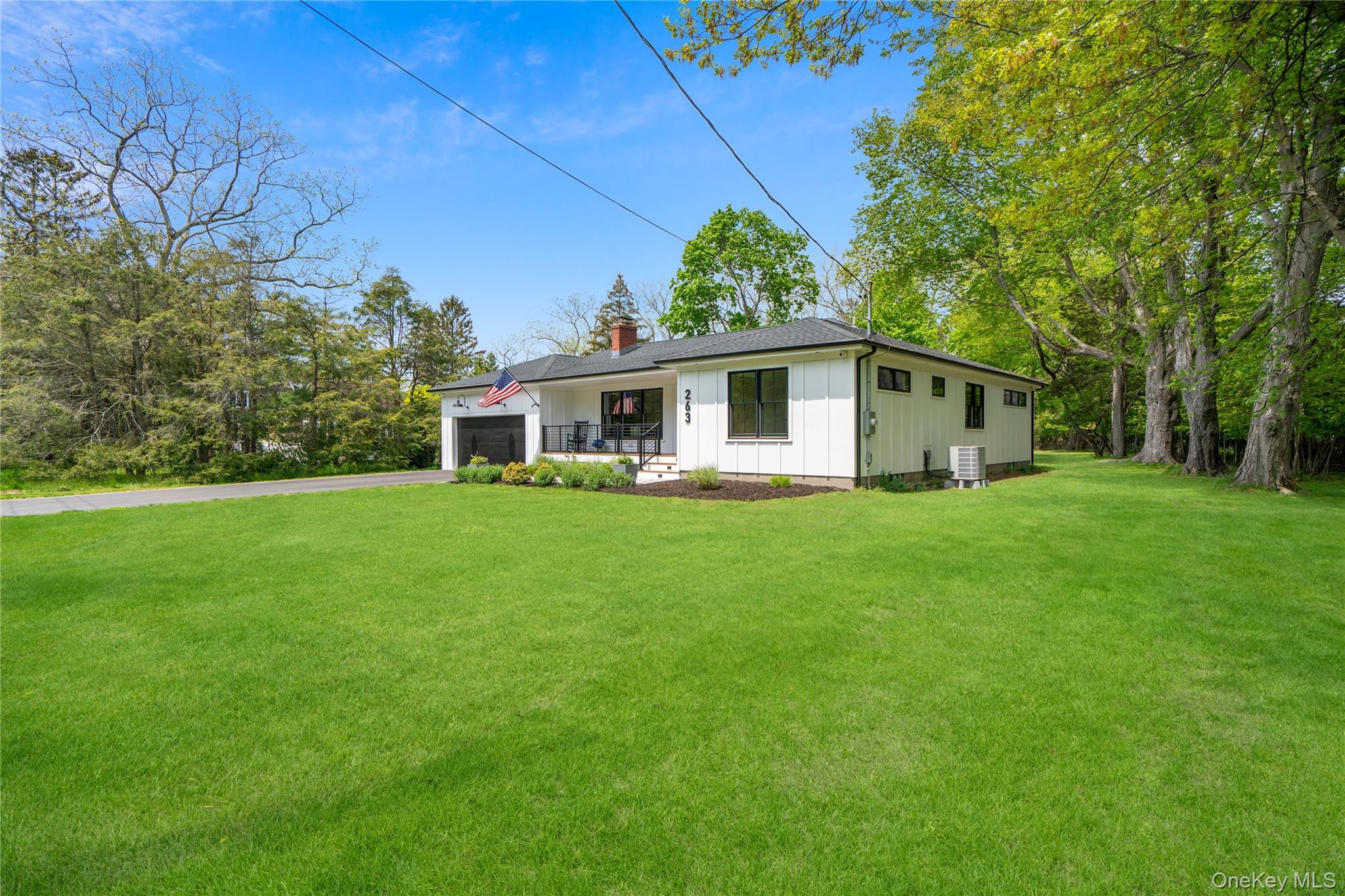 263 Beaver Dam Road Brookhaven, NY 11719 - Photo 2 of 32 a front view of house with yard and green space