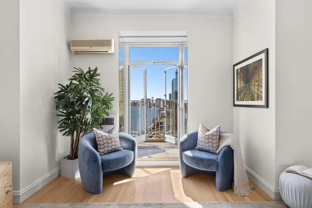 a spacious bedroom with a bed and a couch