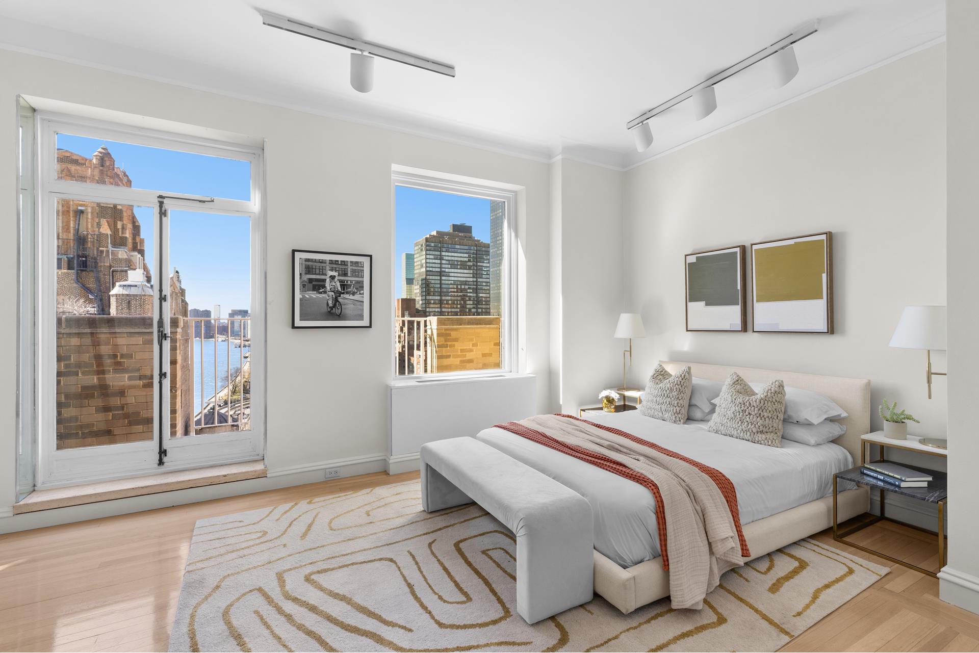 435 East 52nd Street, Unit 15A Manhattan, NY 10022 - Photo 12 of 17 a bedroom with a bed and a window