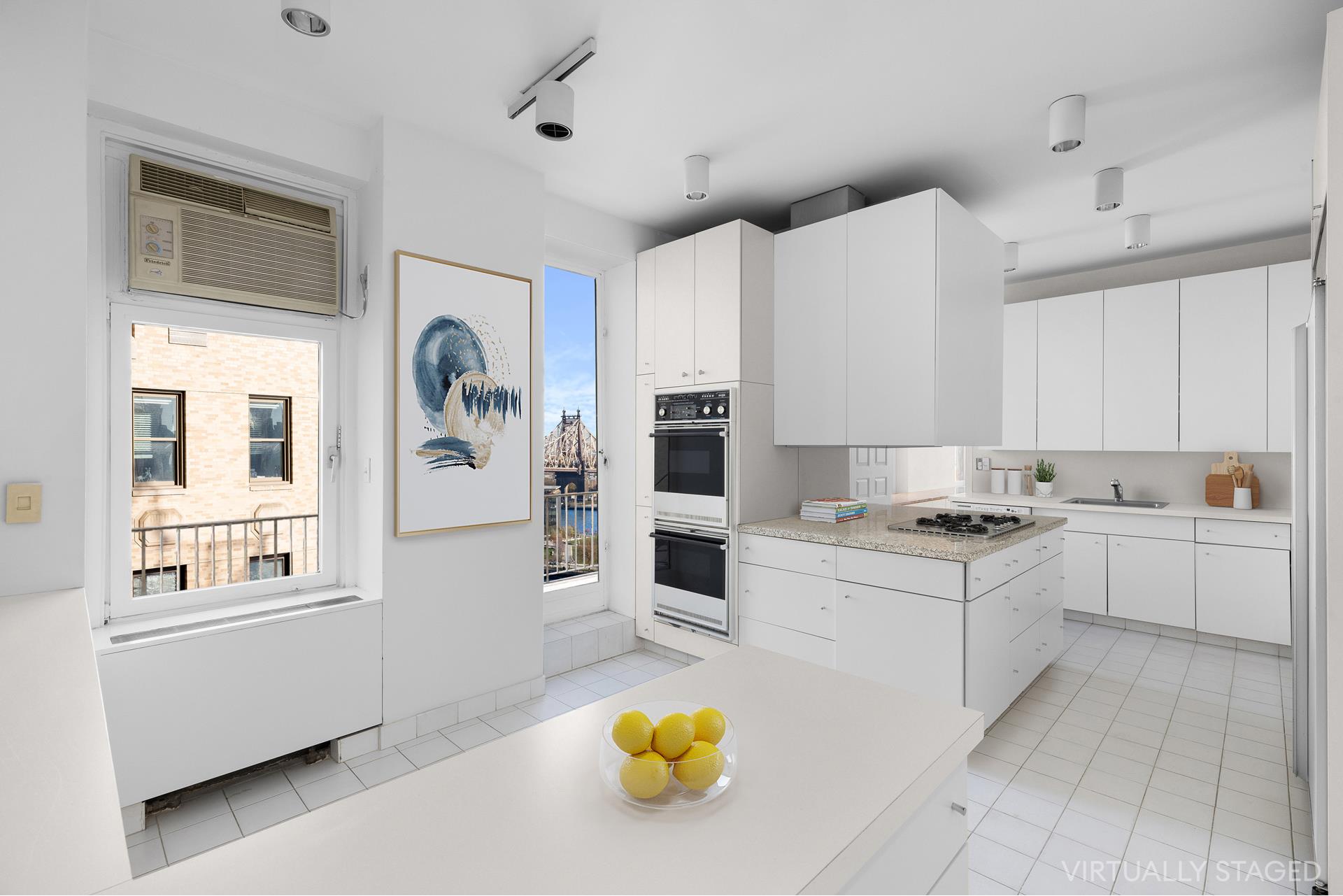435 East 52nd Street, Unit 15A Manhattan, NY 10022 - Photo 16 of 17 a kitchen with a stove and a white refrigerator