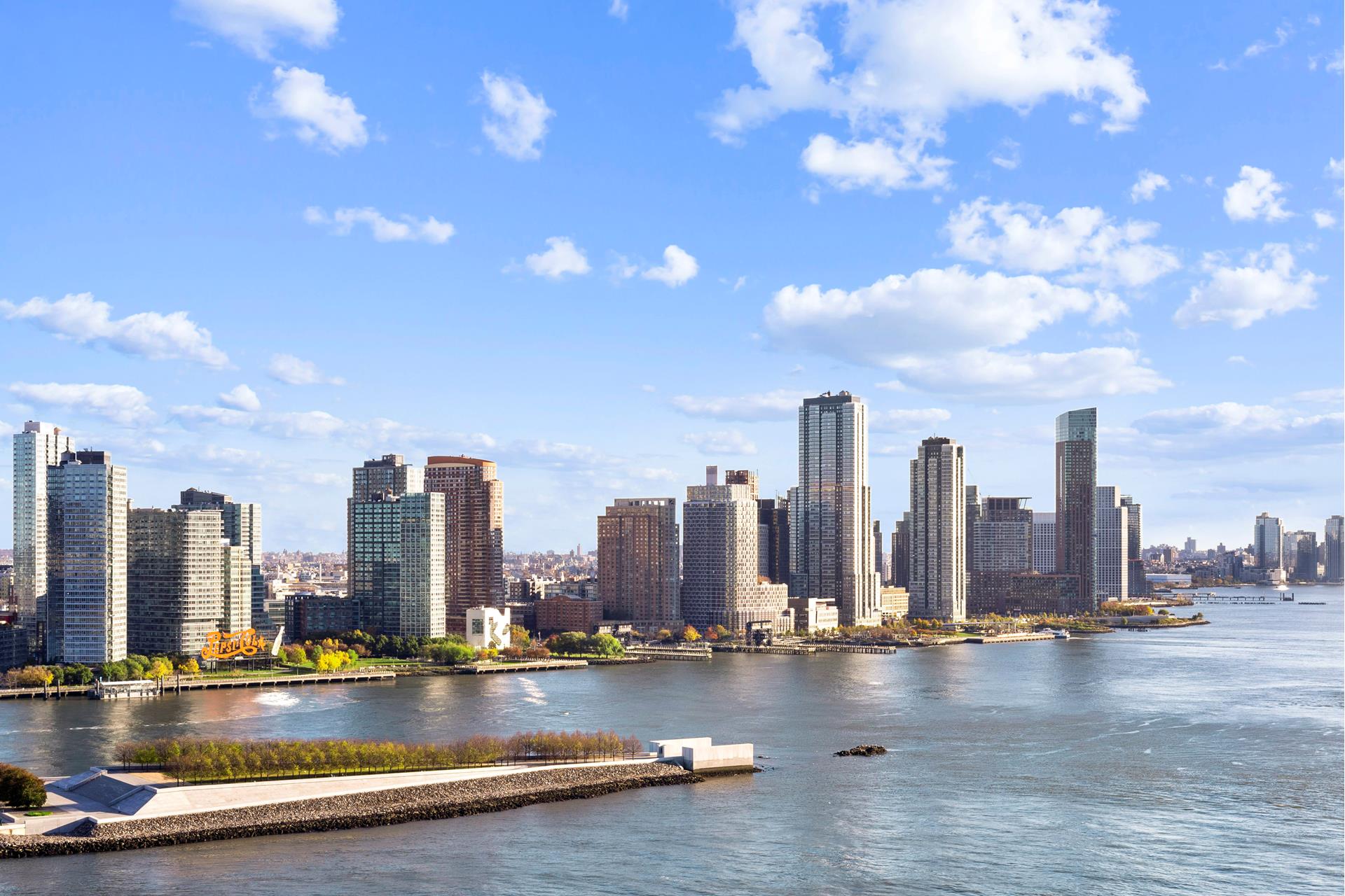 435 East 52nd Street, Unit 15A Manhattan, NY 10022 - Photo 7 of 17 a view of a city with tall buildings