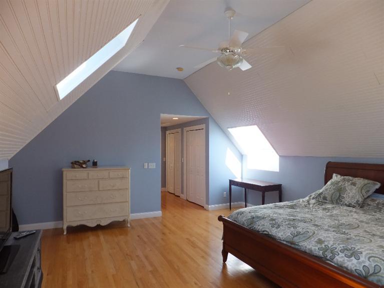 2179 Service Road West Barnstable, MA 02668 - Photo 17 of 26 a bedroom with a bed and a dresser