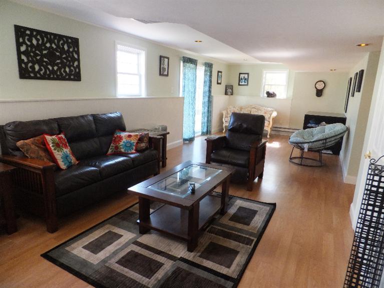 2179 Service Road West Barnstable, MA 02668 - Photo 20 of 26 a living room with furniture and wooden floor