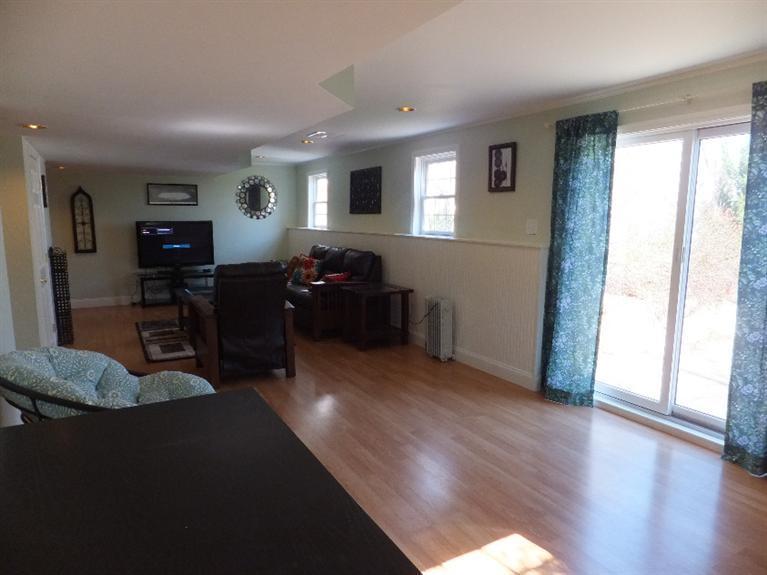 2179 Service Road West Barnstable, MA 02668 - Photo 21 of 26 a living room with furniture and a wooden floor
