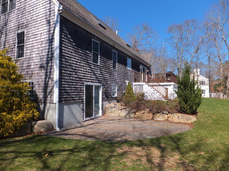 2179 Service Road West Barnstable, MA 02668 - Photo 23 of 26 a front view of a house with a yard and garage