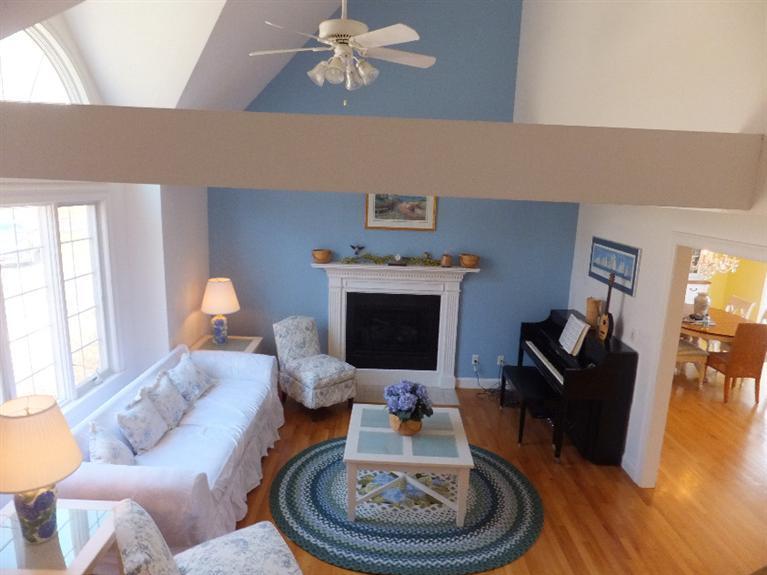 2179 Service Road West Barnstable, MA 02668 - Photo 10 of 26 a living room with furniture a fireplace and wooden floor
