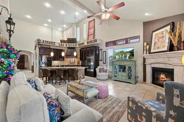 a living room with fireplace furniture and a fireplace