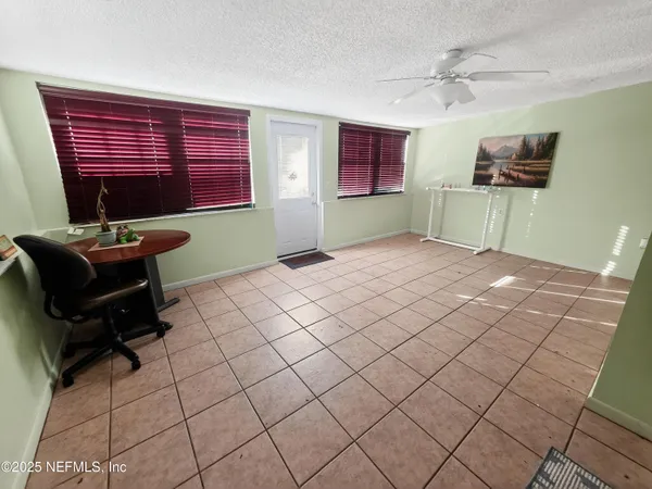 a workspace with furniture and window
