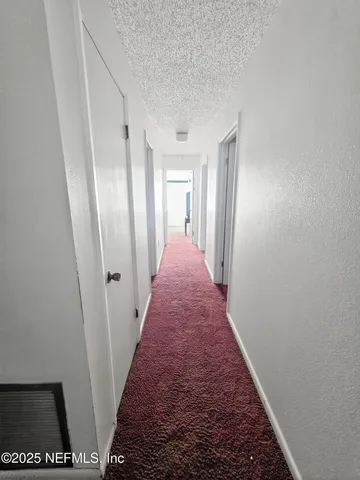 a view of hallway with stairs