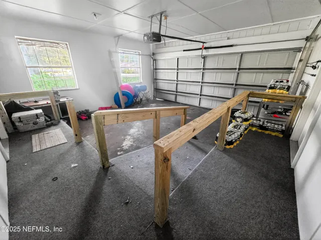 a view of gym equipment with windows