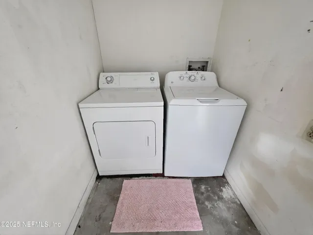 a utility room with dryer and washer