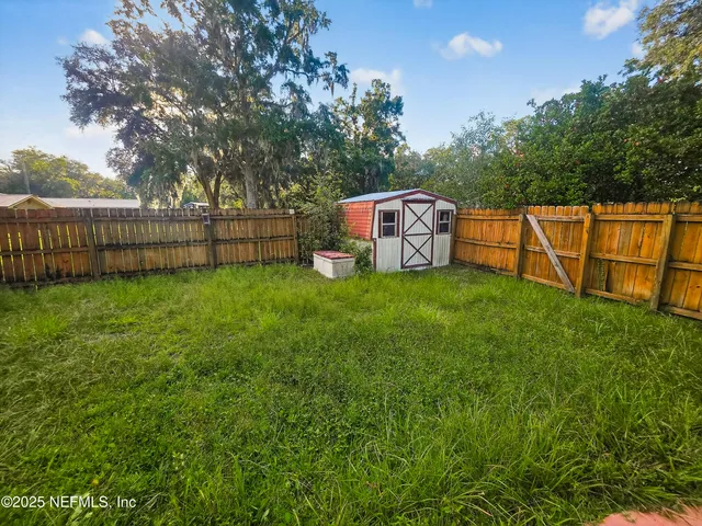 a view of a golf course with a lake view