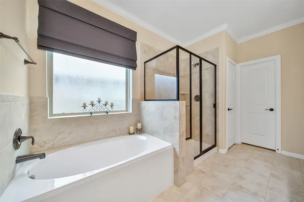 a spacious bathroom with a double vanity sink mirror and double