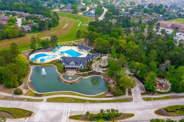 an aerial view of a swimming pool and outdoor space