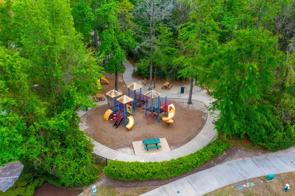 an outdoor space with furniture and garden