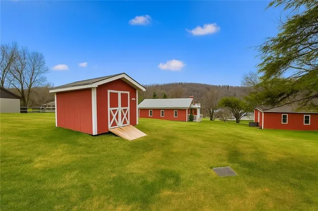 a view of a house with a big yard