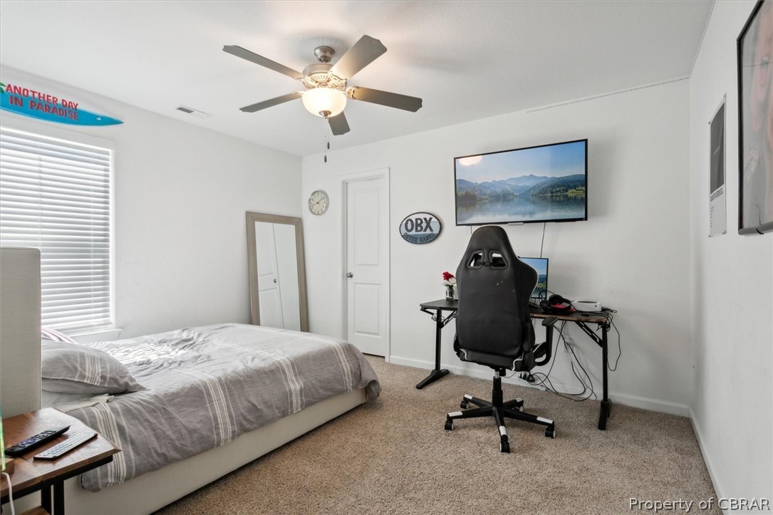2051 Holland Corner Road Suffolk, VA 23437 - Photo 33 of 50 Bedroom featuring light colored carpet and ceiling fan
