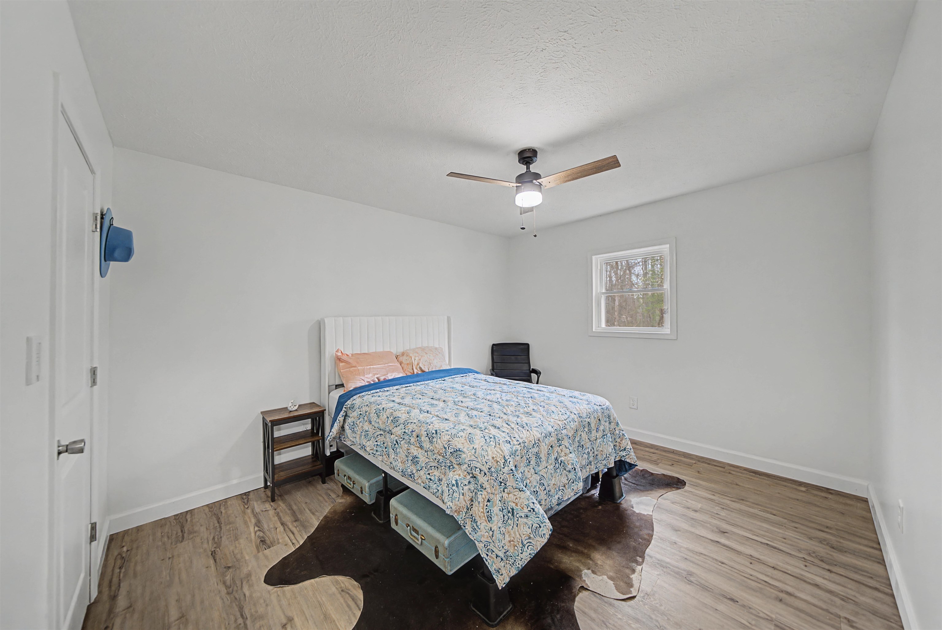 8040 45th Highway South Ramer, TN 38367 - Photo 15 of 20 a bedroom with a bed and a chandelier