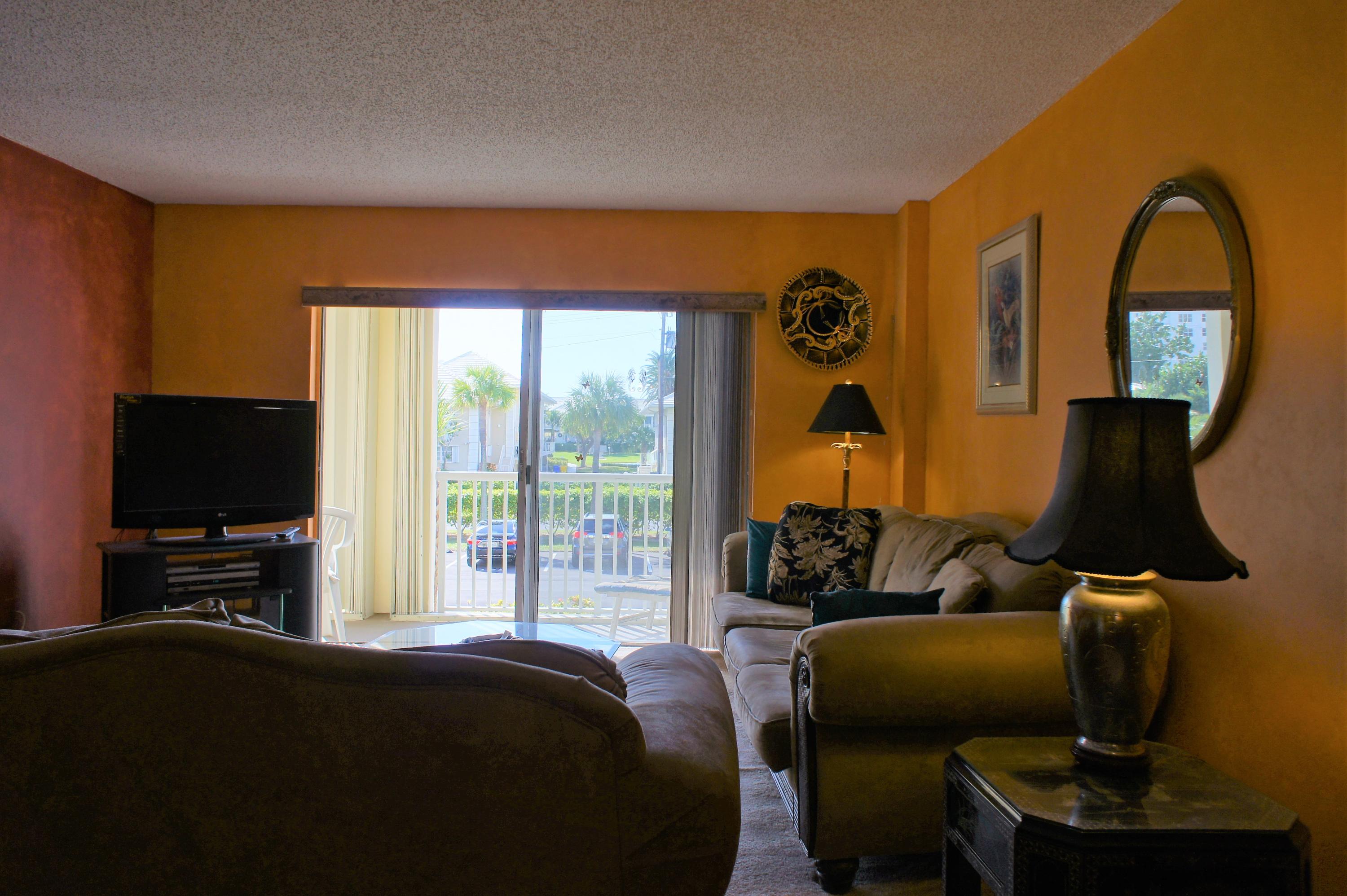 951 De Soto Road, Unit 234 Boca Raton, FL 33432 - Photo 44 of 44 a bedroom with a bed chair and a window