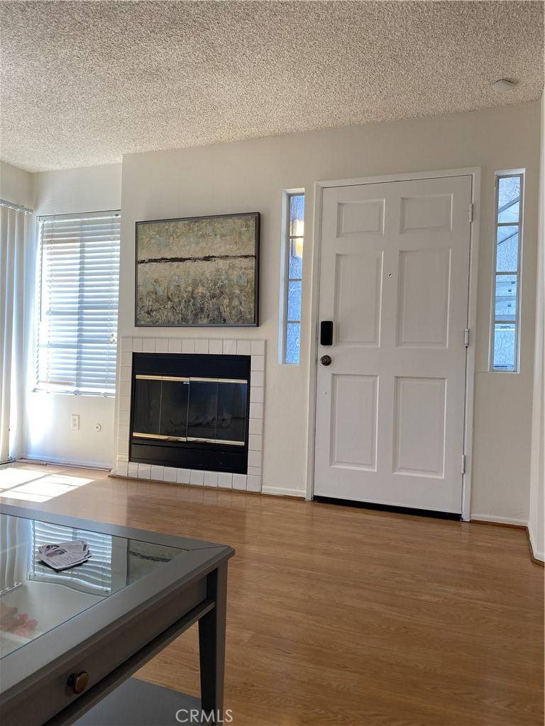 8205 Mondavi Place Rancho Cucamonga, CA 91730 - Photo 3 of 5 a living room with furniture and a fireplace
