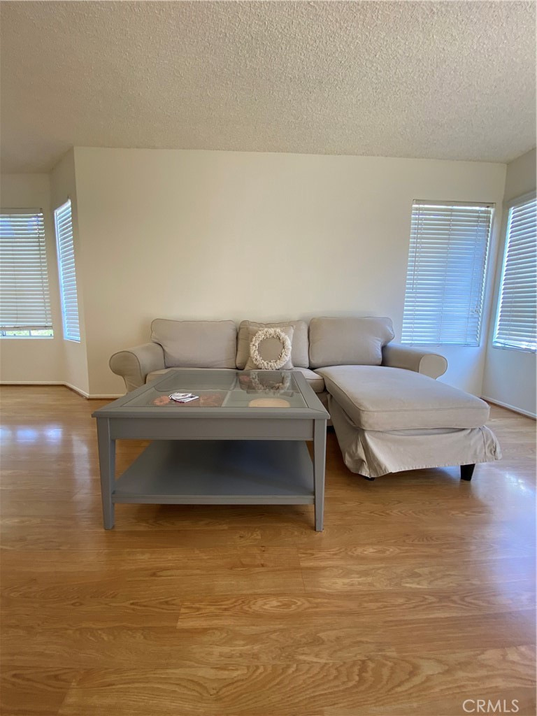 8205 Mondavi Place Rancho Cucamonga, CA 91730 - Photo 4 of 5 a bedroom with furniture and a wooden floor