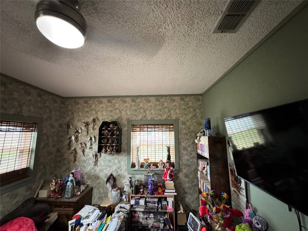 350 Quail Meadow Road Seadrift, TX 77983 - Photo 2 of 22 a living room with furniture a flat screen tv and a window