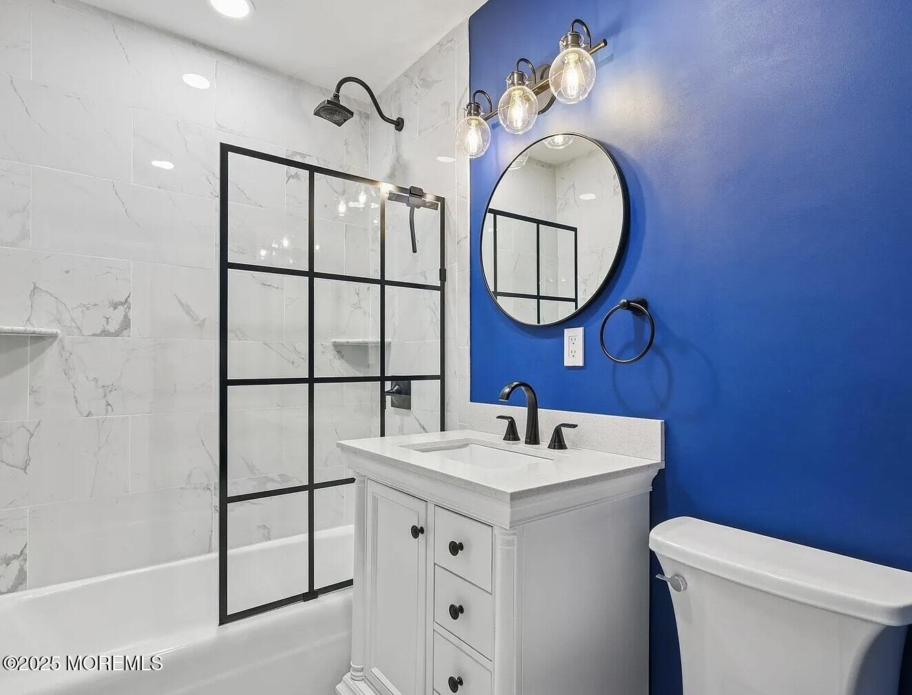 1111 River Road, Unit H20 Edgewater, NJ 07020 - Photo 8 of 14 a bathroom with a sink a mirror a vanity and a toilet