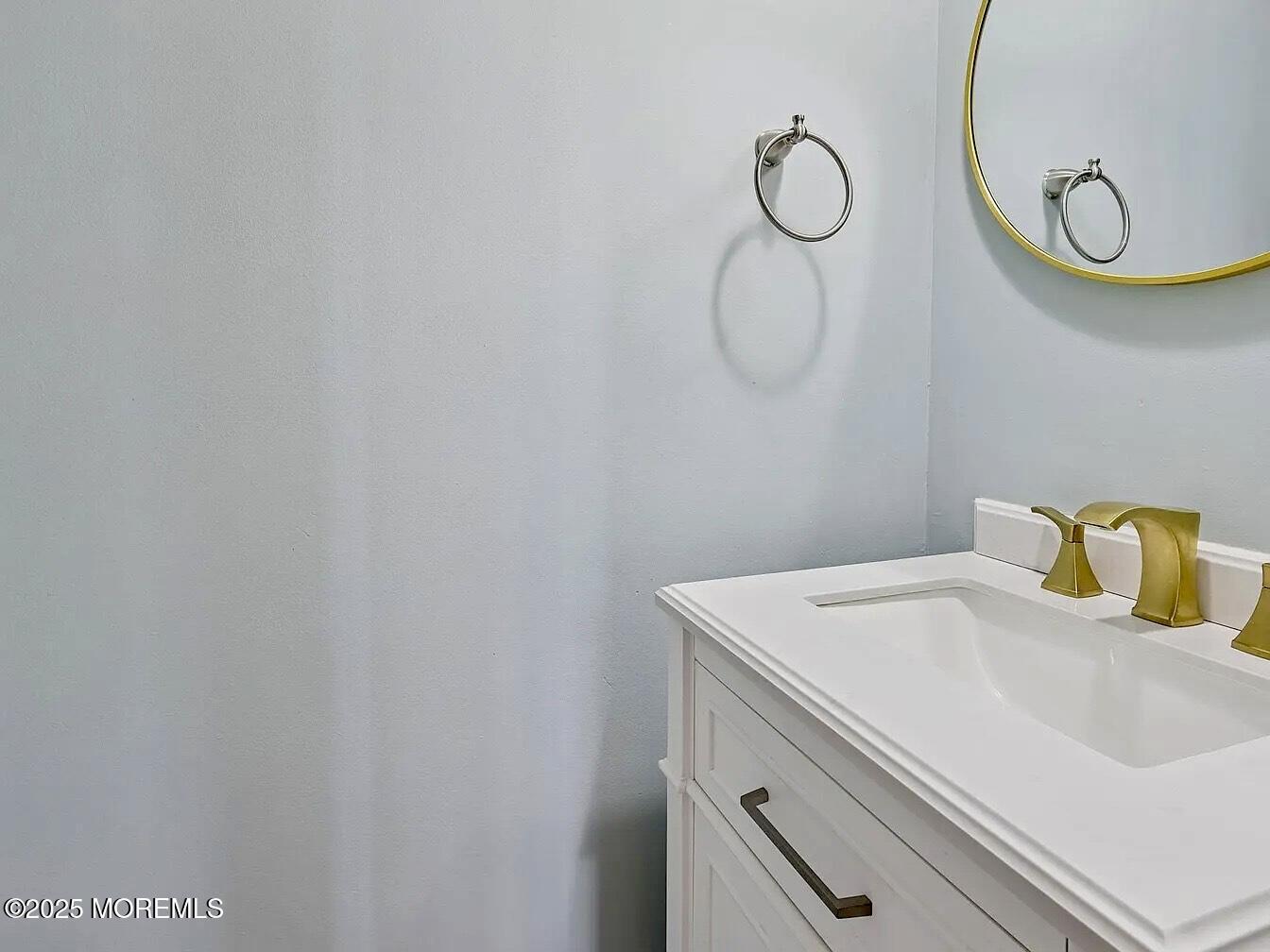 1111 River Road, Unit H20 Edgewater, NJ 07020 - Photo 9 of 14 a bathroom with a sink and a mirror