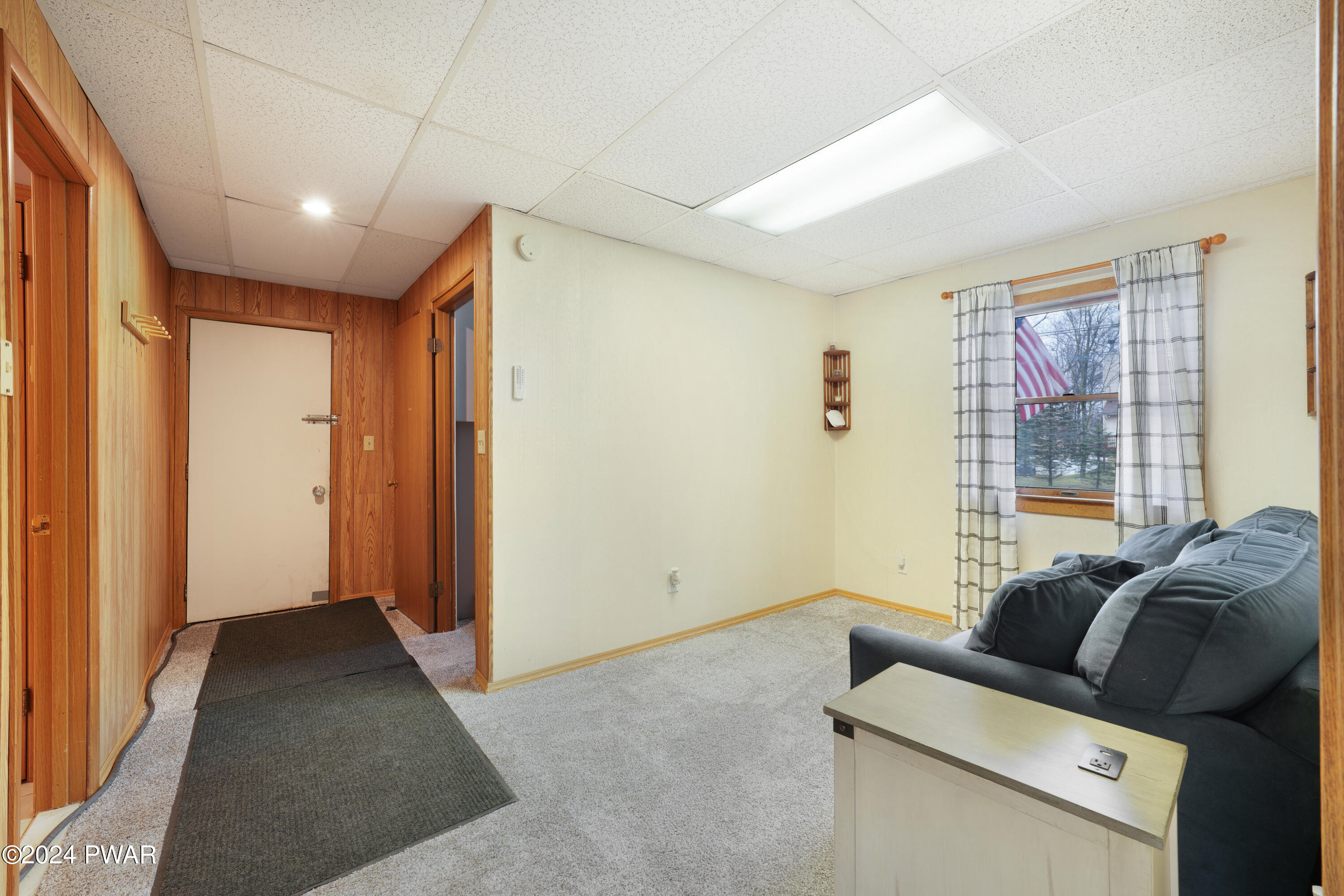 161 Skyview Road Dingmans Ferry, PA 18328 - Photo 19 of 31 a living room with furniture and a window
