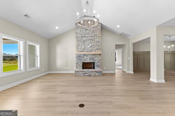 a view of a kitchen with a sink stainless steel appliances and cabinets