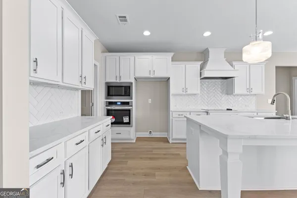 a view of a livingroom with a ceiling fan and window
