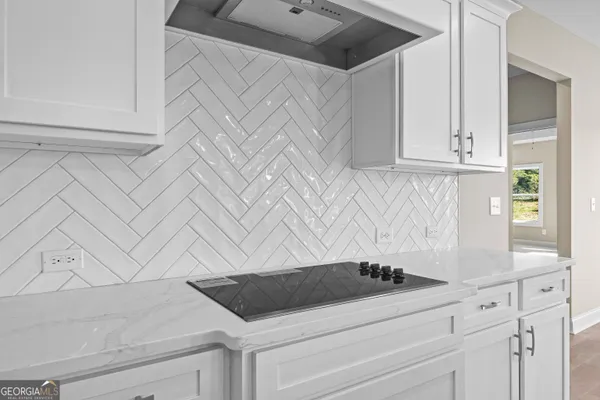 a bathroom with a toilet a sink and a mirror