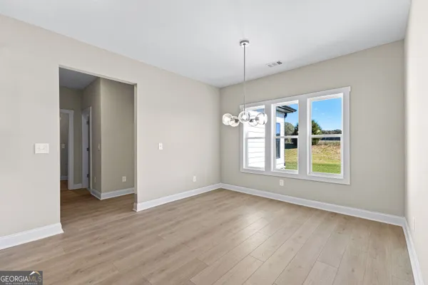a view of an empty room with a window