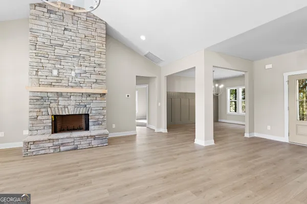 a front view of house with yard and trees