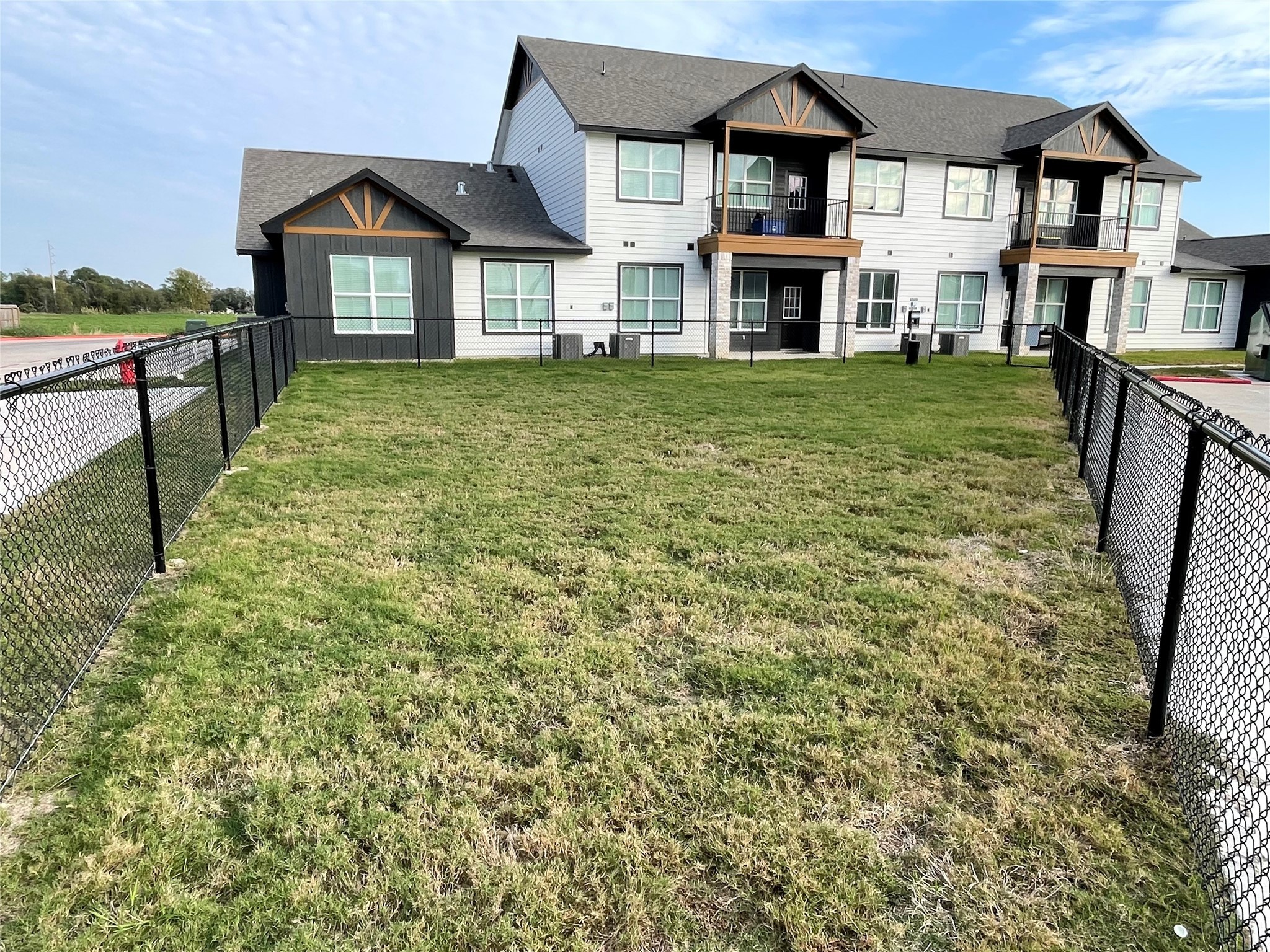802 West Loop El Campo, TX 77437 - Photo 18 of 21 a front view of a house with a yard