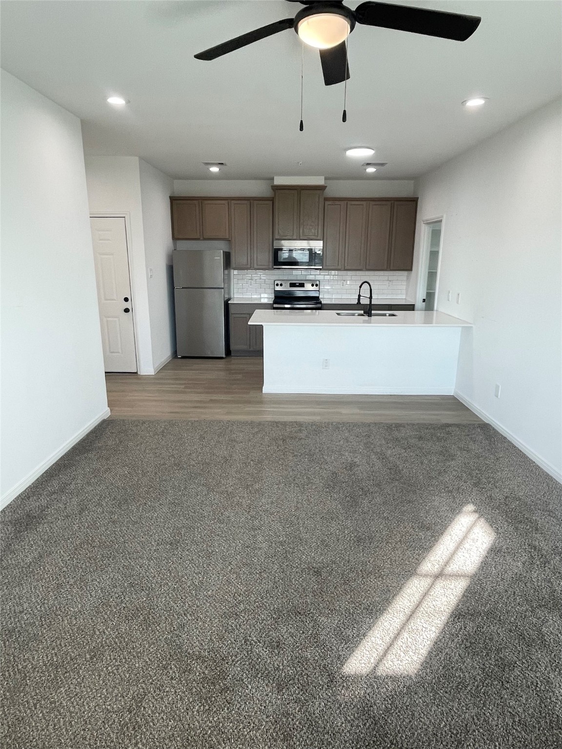 802 West Loop El Campo, TX 77437 - Photo 8 of 21 a view of kitchen with refrigerator and window