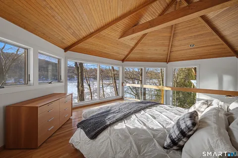 a view of walk in closet with wooden floor