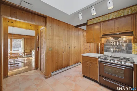 a kitchen with a stove and a cabinet