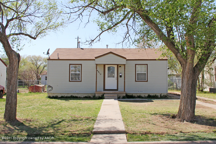 4612 Parker Street Amarillo, TX 79110 - Photo 1 of 17 a front view of a house with a yard