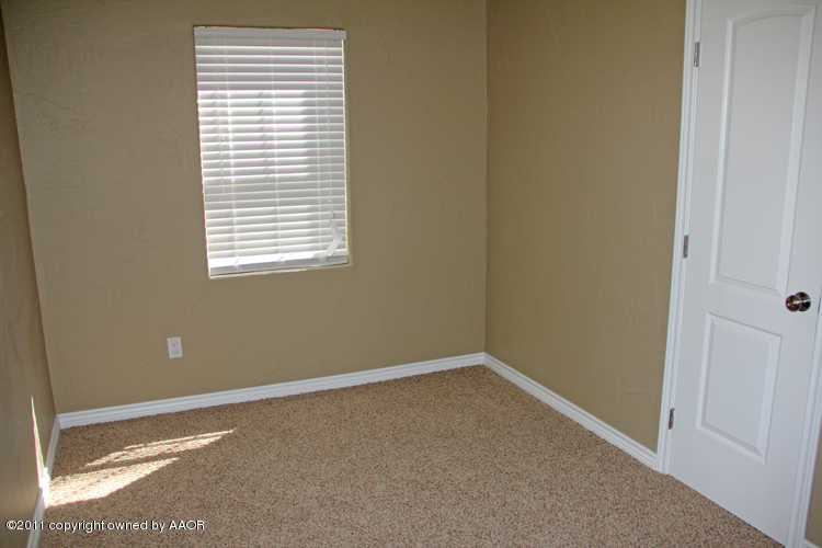 4612 Parker Street Amarillo, TX 79110 - Photo 11 of 17 a view of an empty room with a window