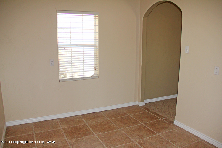 4612 Parker Street Amarillo, TX 79110 - Photo 8 of 17 an empty room with a window