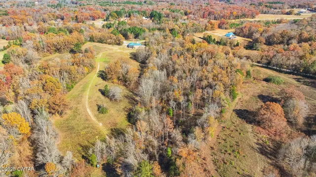 a white bath tub sitting next to a white toilet