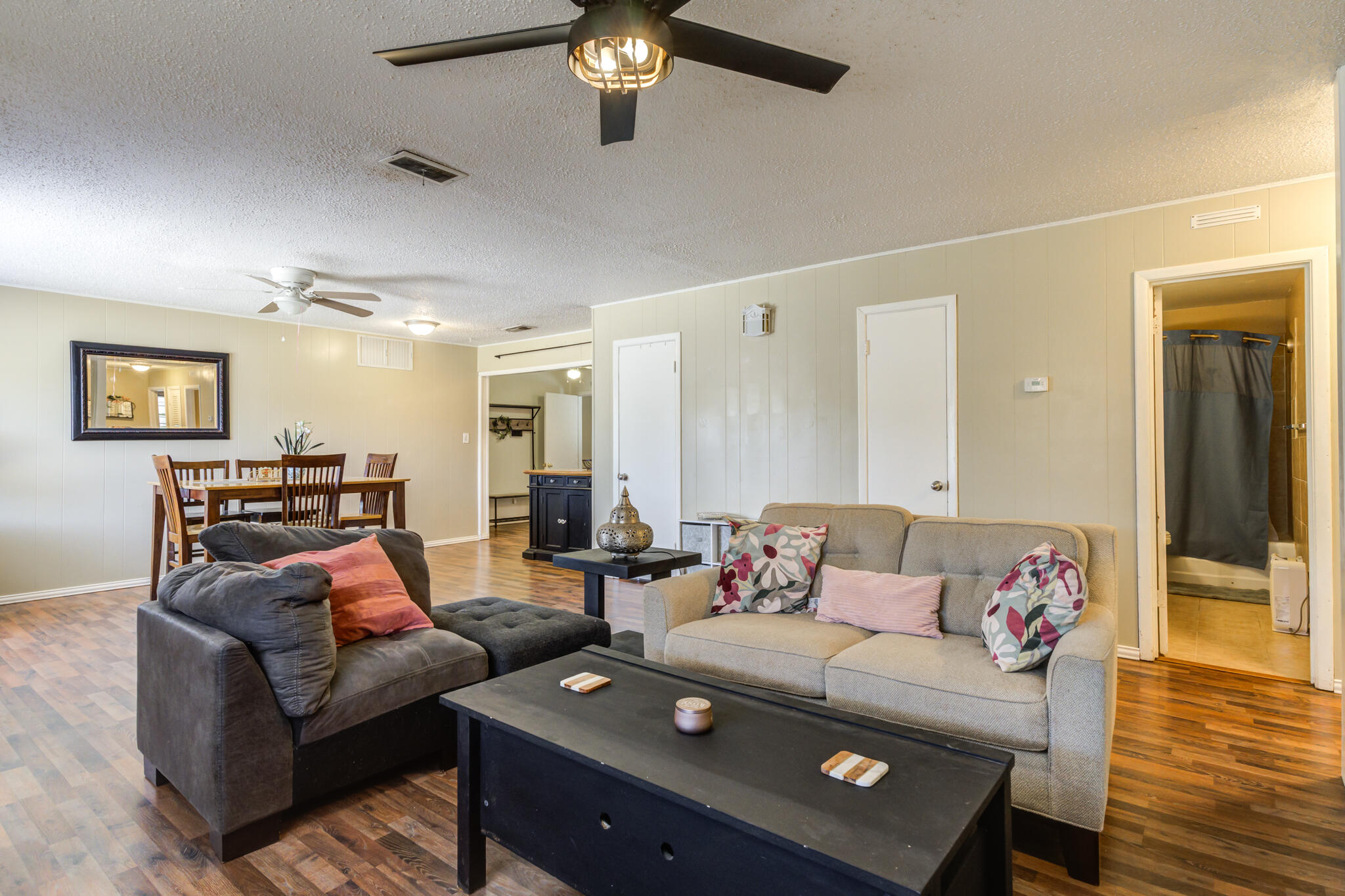 2812 62nd Street Lubbock, TX 79413 - Photo 16 of 45 a living room with furniture and a flat screen tv